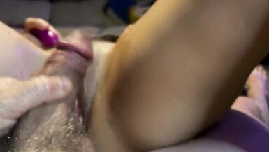 close up view of a wet pink pussy getting pissed on