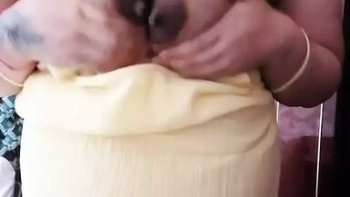 Pregnant wife milking her Asian boobs - 1 image