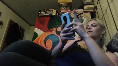 Hot blonde smokes clove cigarettes, plays on phone and plays with tits - 4 image