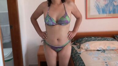 Mature beauty shows off on the beach while masturbating - 1 image