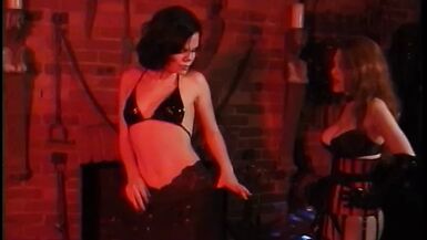 Busty redhead dominates curvy brunette then smacks her ass - 1 image