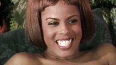 Black chick shows off her tits to seduce the white guy - 8 image