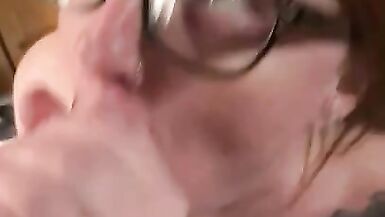 Hot redhead wearing glasses gets a facial - 14 image