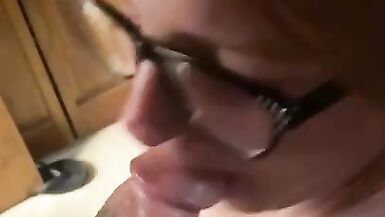 Hot redhead wearing glasses gets a facial - 4 image