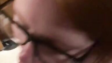 Hot redhead wearing glasses gets a facial - 5 image