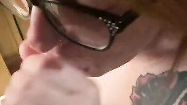 Hot redhead wearing glasses gets a facial - 8 image