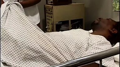 Horny black nurse rides black stud on his hospital bed - 1 image