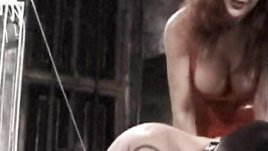 Naughty redhead Mistress shows up in her tight leather dress to punish a lustful stud teasing and pleasing - 3 image