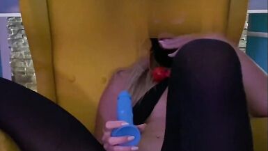 Blonde in Black Stockings under Mask using Gag Ball and Dildo