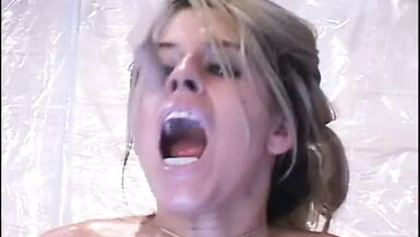 Lusty MILF with giant bristols gets a creamy facial on her favourite couch