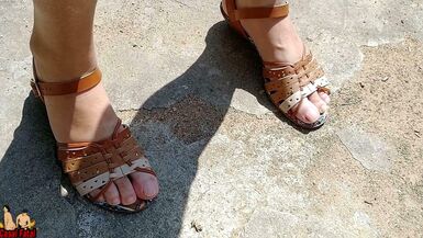 Nude wife with sandals flashing her feet in front yard - 1 image