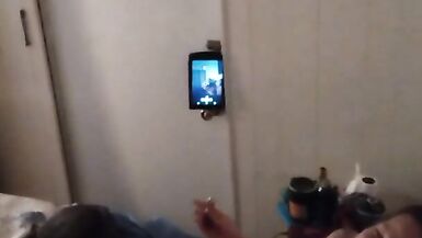 White cute milf in night dress smoking and watching TV