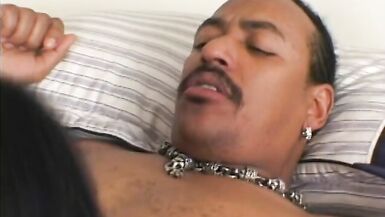 Sexy bad girl sucks a stiff black cock on bed