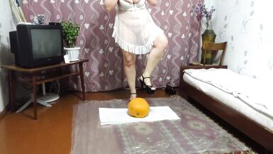 Crush fetish and foot fetish. A chubby milf trampled on a large pumpkin with her heels. Homemade. - 2 image