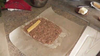 In stockings in high heels no panties and bra sexy mommy MILF Frina continues her nude cooking. Hot and cold minced meat roll on the menu today - 7 image