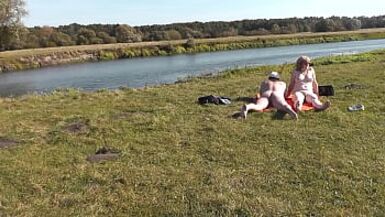 Wild beach. Nudist beach. Outdoors on bank of river lover fucks doggystyle beautiful sexy MILF Frina. Oudoor. Ouside. Naked in public. Sex in public - 1 image