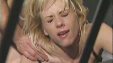 Blonde whore loves having two cocks fucking her in jail - 13 image
