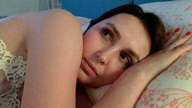 Stepmother and stepson share a bed in a hotel room.