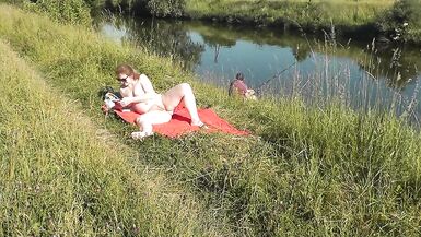 Wild beach. Sexy MILF Platinum naked sunbathing on river bank, random fisherman guy watches. Naked in public. Nude beach - 12 image