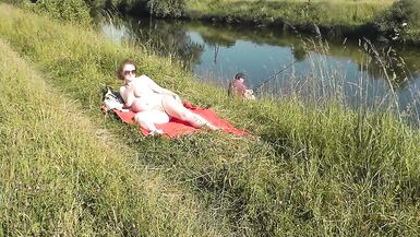 Wild beach. Sexy MILF Platinum naked sunbathing on river bank, random fisherman guy watches. Naked in public. Nude beach - 13 image