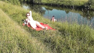 Wild beach. Sexy MILF Platinum naked sunbathing on river bank, random fisherman guy watches. Naked in public. Nude beach - 6 image