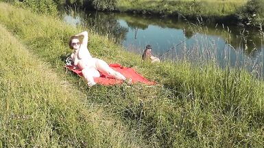 Wild beach. Sexy MILF Platinum naked sunbathing on river bank, random fisherman guy watches. Naked in public. Nude beach - 8 image