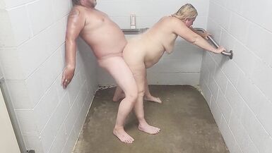 Husband and blonde wife showering - 10 image