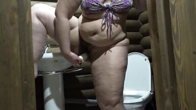 A fat milf sits on the toilet, fingering her hairy pussy and with a bottle of deodorant fucks her deep vagina. Home fetish. Close-up meaty hole amateur. - 12 image