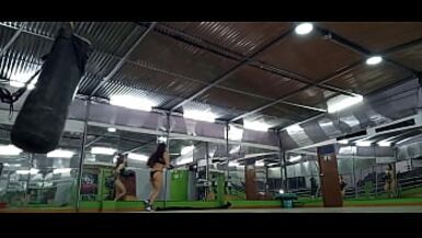 THE SENSUAL MILF CUMS IN A SEXY BIKINI WHILE WORKING OUT AT THE GYM - 1 image