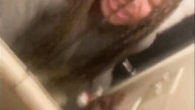 Blasian bent over bathroom sink while roommates in other room - 10 image