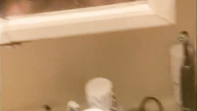 Blasian bent over bathroom sink while roommates in other room - 15 image
