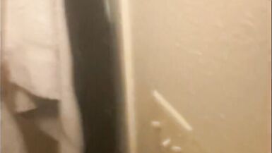 Blasian bent over bathroom sink while roommates in other room - 2 image