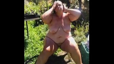 Watch me wash off outdoors in the garden - 1 image