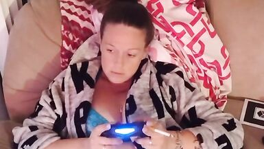 Caught gamer girl in panties and bra playing video games with legs wide open