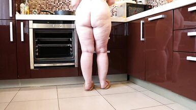 Naked mature bbw in the kitchen. plump legs. - 2 image