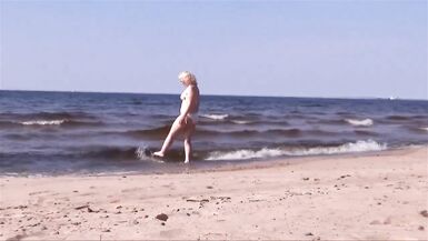 Hot MILF in a white bikini on the beach - 2 image
