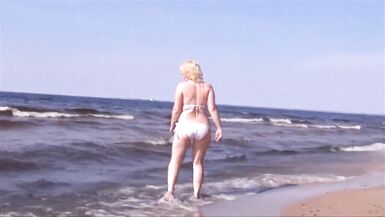 Hot MILF in a white bikini on the beach - 4 image
