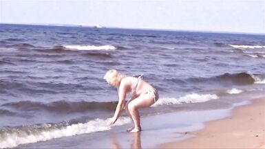Hot MILF in a white bikini on the beach - 8 image