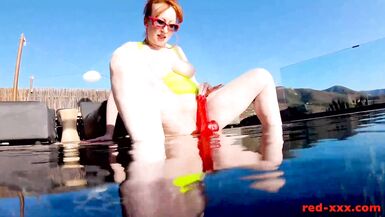 Red XXX fucks her pussy with a toy in the pool - 15 image