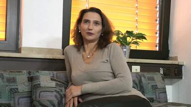 Happy and smiling sexy brunette german milf gets up and dildoes her pussy while she strokes her small tits