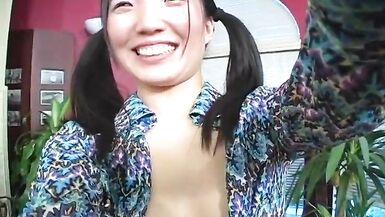 Horny little Asian babe loves shoving a huge dildo in her cunt