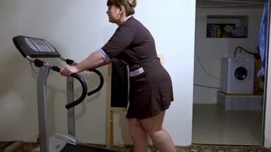 With an anal plug in the ass. on the treadmill Mature bbw milf housewife. - 1 image