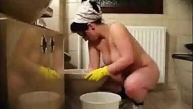 Cleaning lady wants a raise, so she cleans naked - 1 image