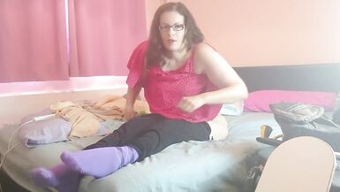 Paraplegic dark brown Purplewheelz removes foley catheter on the ottoman - 3 image