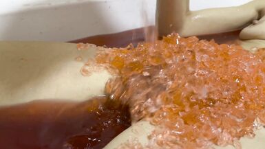 A baths in red coloured Jelly Cubes - 12 image