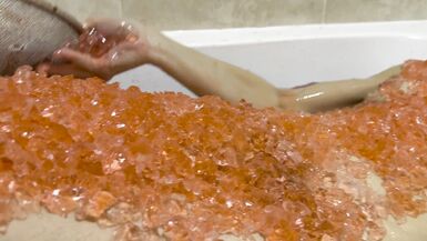 A baths in red coloured Jelly Cubes - 15 image
