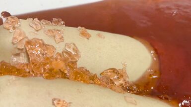 A baths in red coloured Jelly Cubes - 6 image