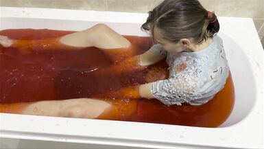A baths in red coloured Jelly Cubes - 8 image