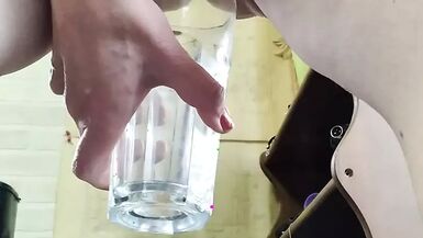 Amateur mature woman with big pussy lips pees in glass - 1 image
