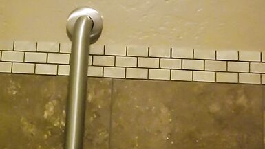 Horny milf plays in bar bathroom